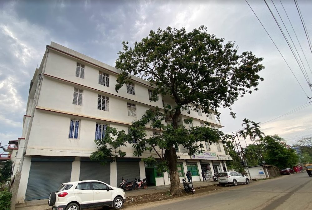 Street view of the building housing Evita GyneCare Clinic, with parking in front